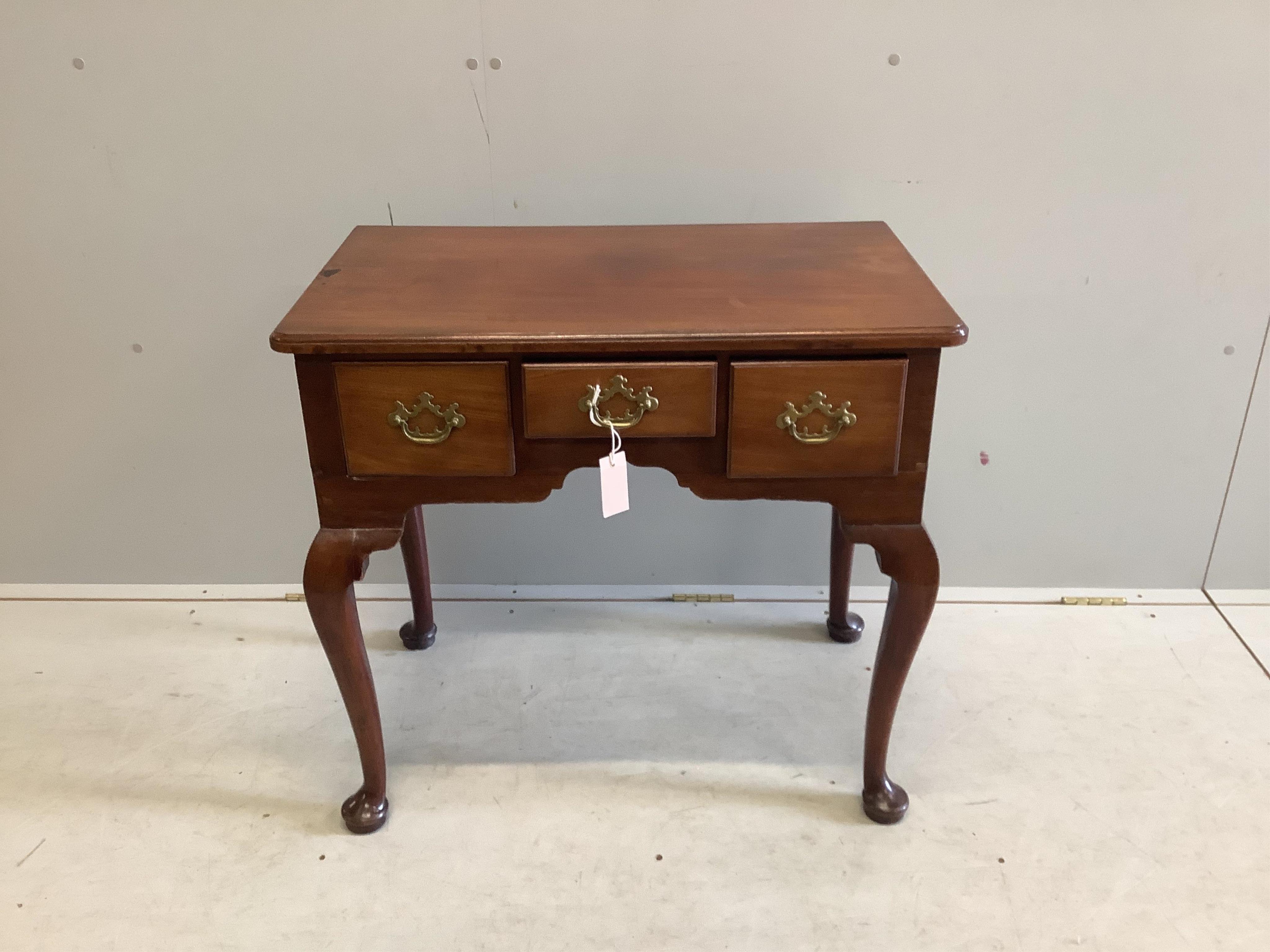 A George III mahogany lowboy fitted three frieze drawers and cabriole pad feet, brass handles, width 76cm, depth 45cm, height 70cm. Condition - fair-good